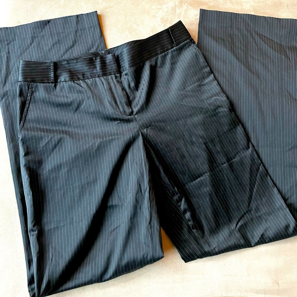 Black satin pinstriped pants. Great staple to your wardrobe. Dress up or down.